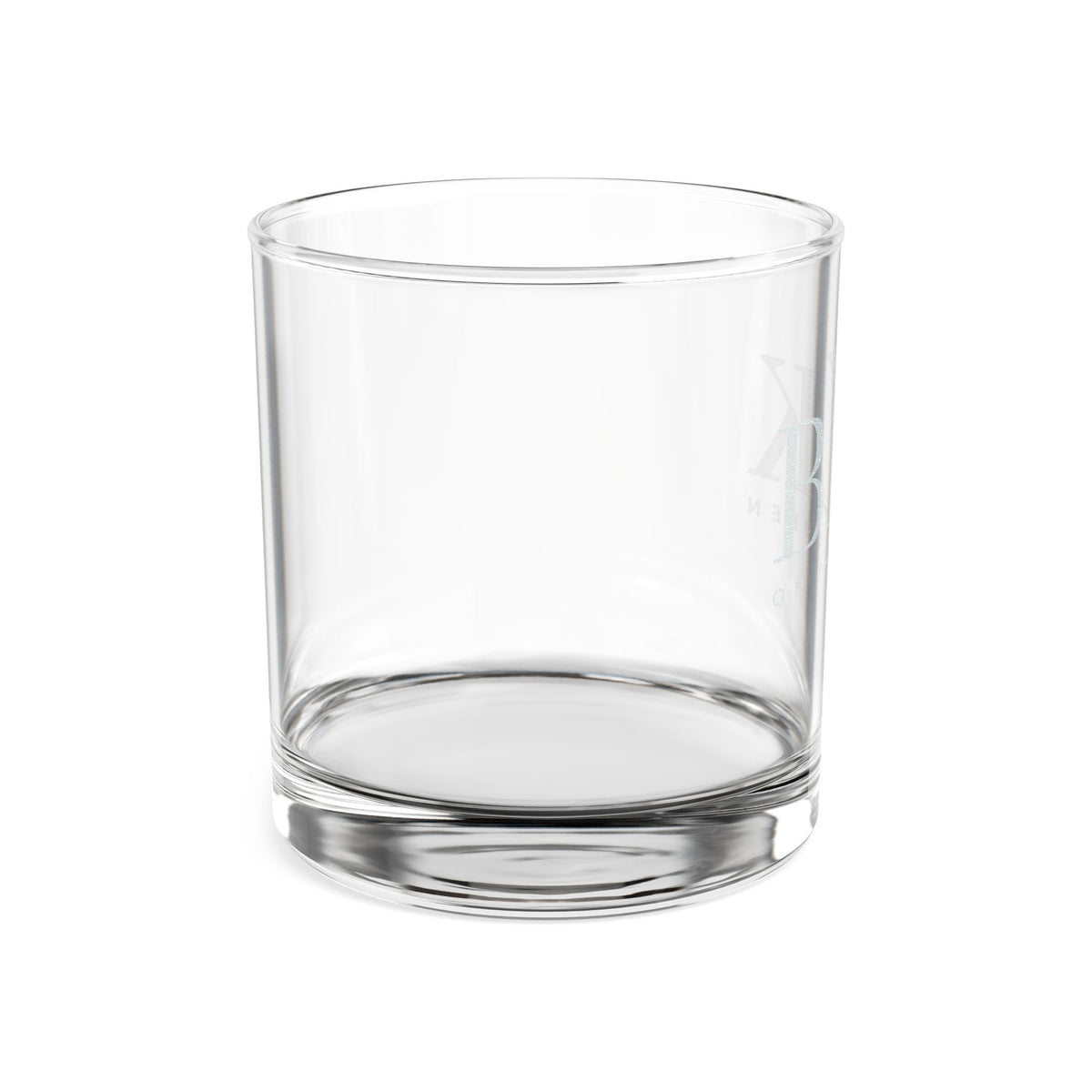BLK on the Green engraved rocks glass turned to show the heavy weighted base