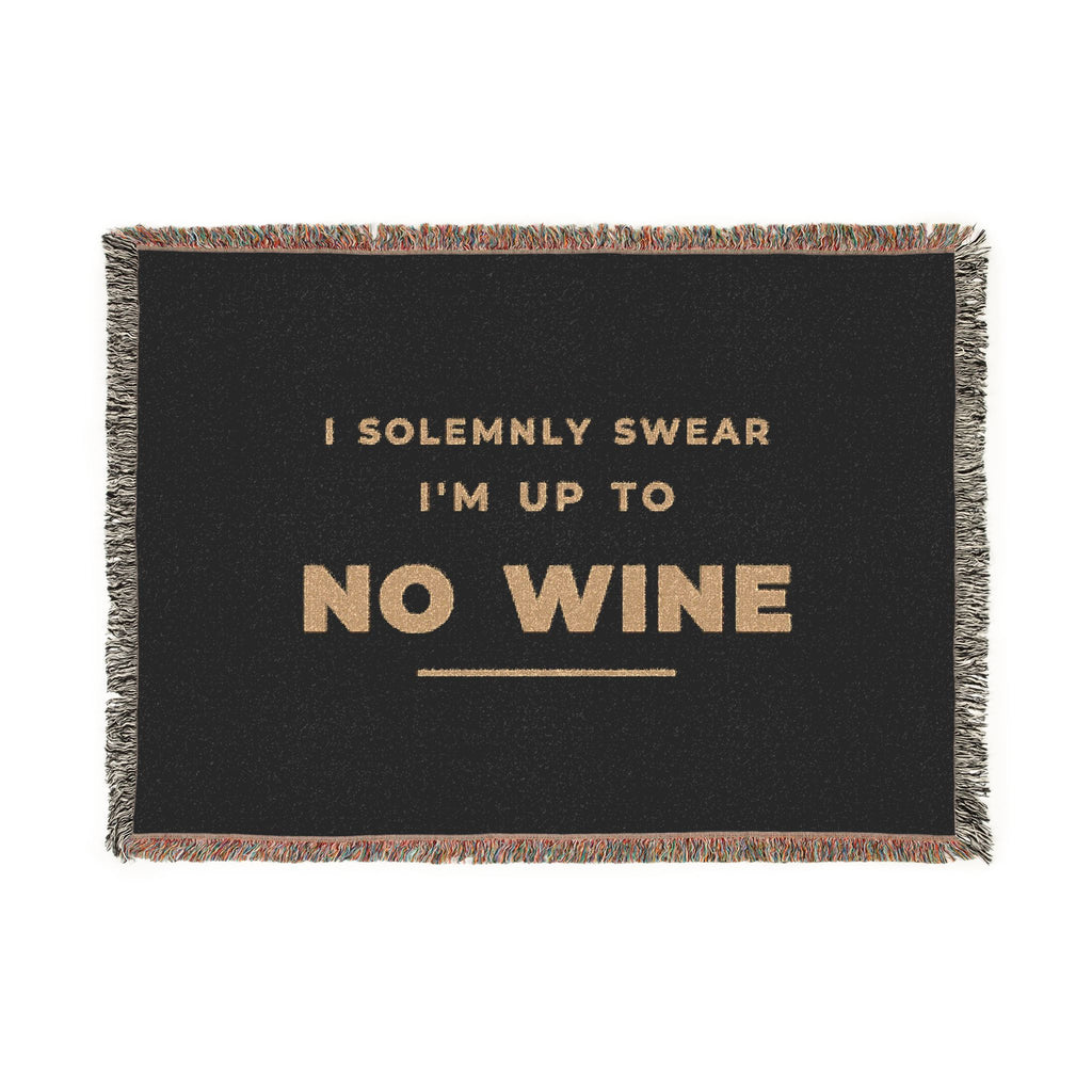 I Solemnly Swear I'm Up to No Wine woven blanket, front view, antique gold lettering woven into black cotton with a fringed edge