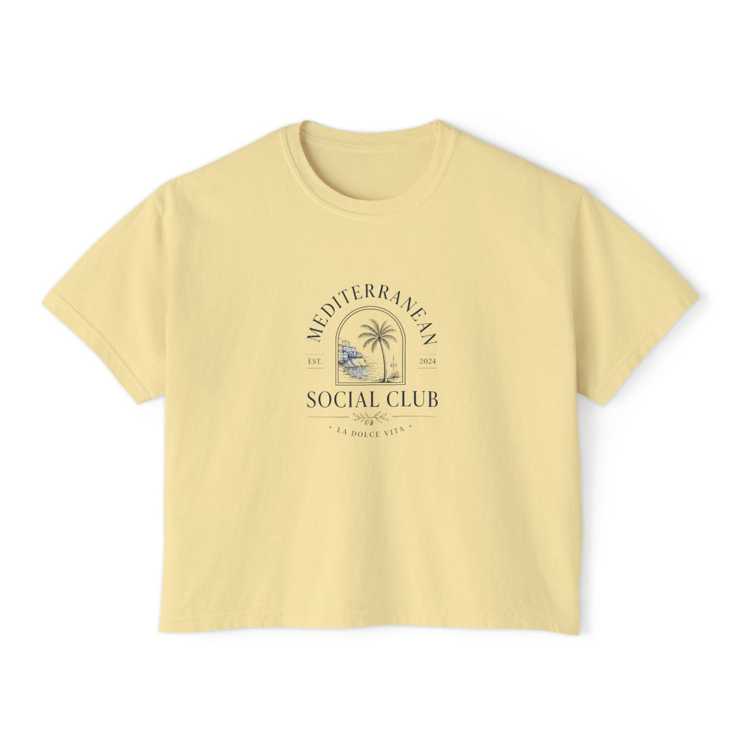 Butter yellow boxy tee with a navy Mediterranean Social Club crest and La Dolce Vita text