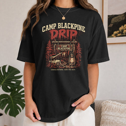 Woman wearing black Camp Blackpine Drip tee, retro horror camp graphic