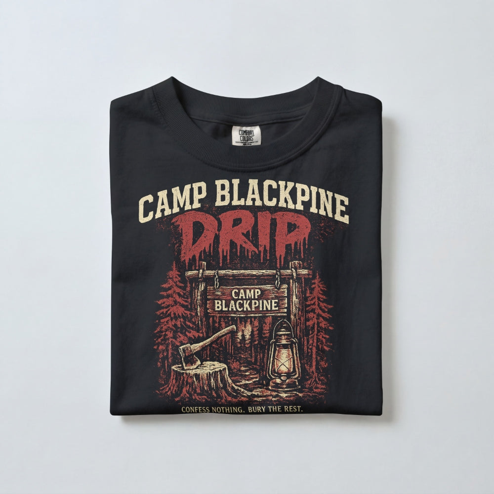 Folded black Camp Blackpine Drip tee showing the front graphic