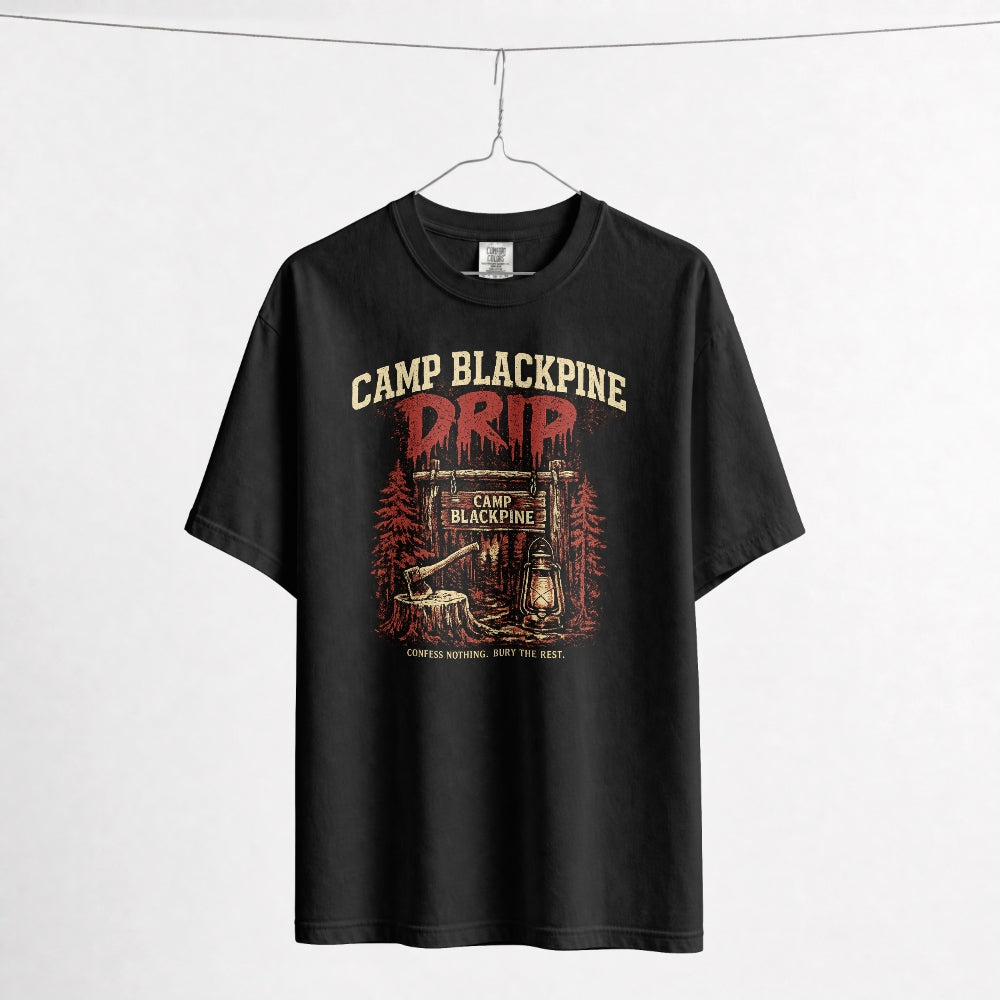 Black Camp Blackpine Drip Comfort Colors tee on a hanger