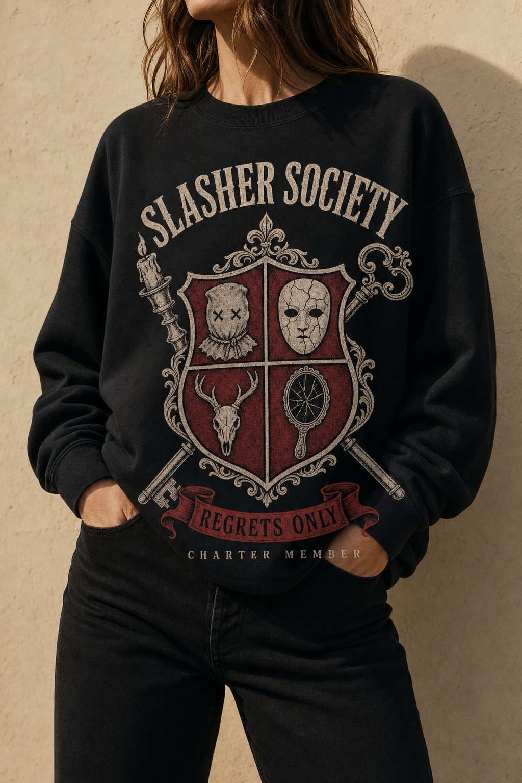 Woman wearing the Slasher Society black crewneck against a cream wall