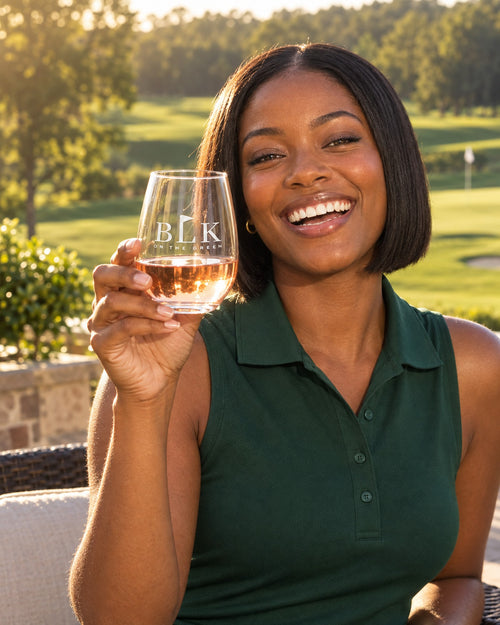 Lifestyle photo of the BLK on the Green Engraved Stemless Wine Glass