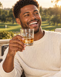 Lifestyle photo of the BLK on the Green Engraved Whiskey Glass