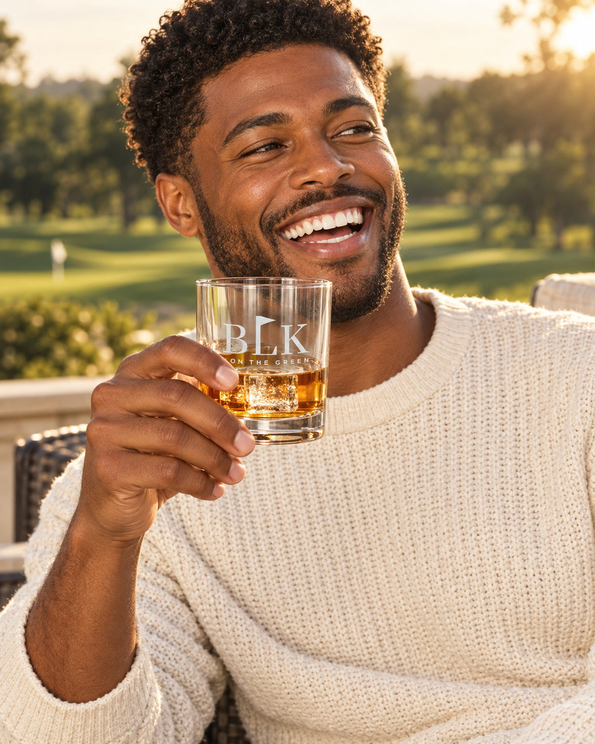 Lifestyle photo of the BLK on the Green Engraved Whiskey Glass